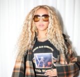 Beyonce Promotes Cowboy Carter in a Chloe Oversized Plaid Cape and A Linda Martell Color Me Country Tee available at Fashion Bomb Daily Shop!